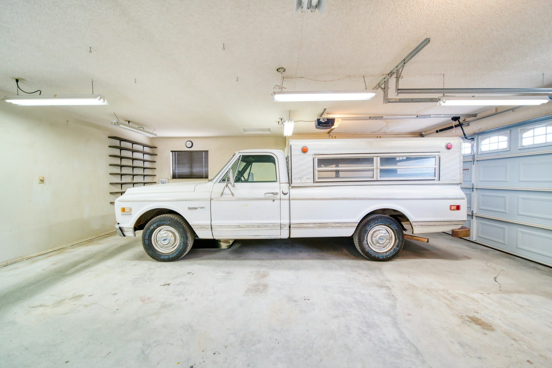 Truck in garage install bay — train horn install workshop context