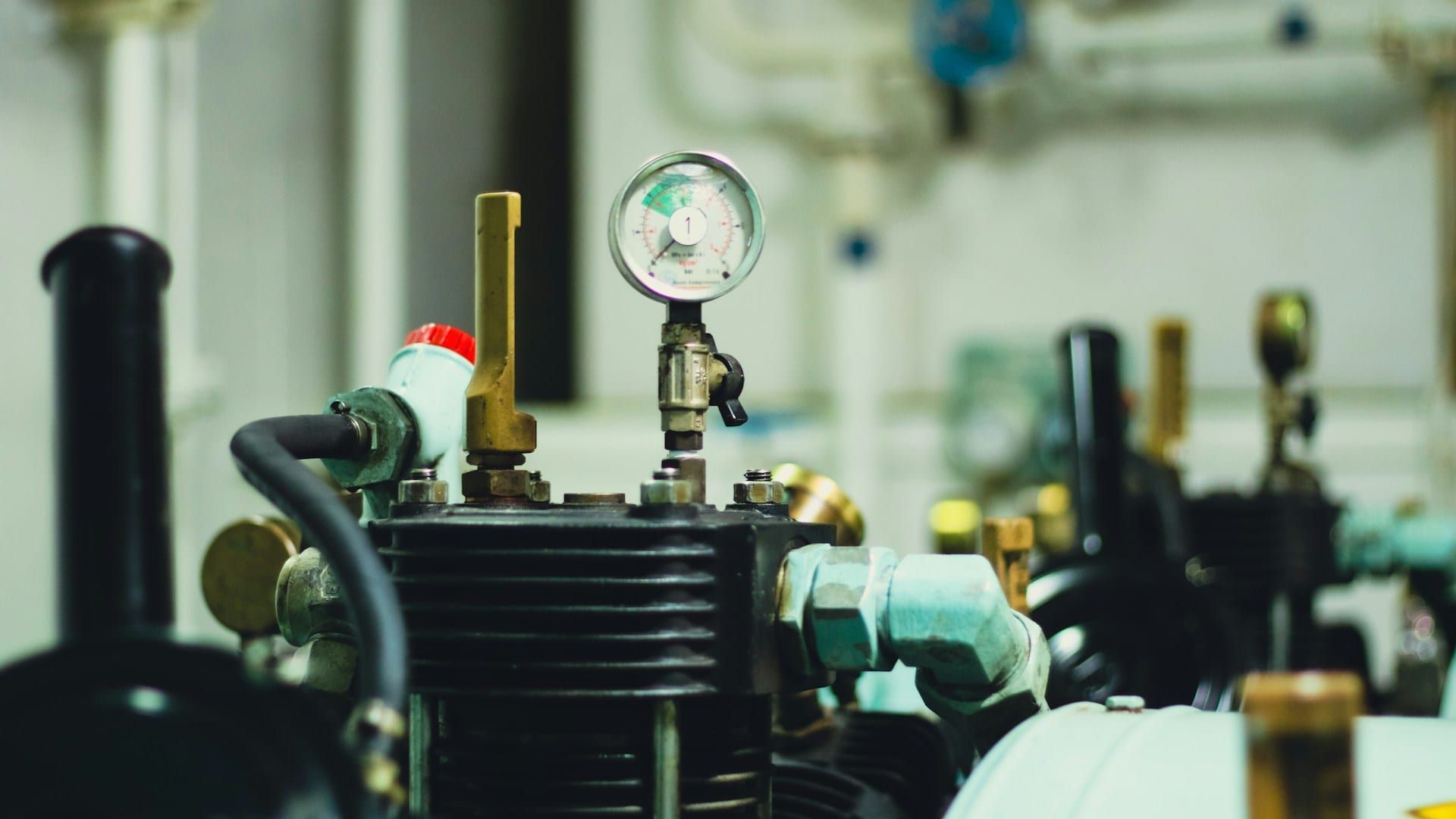 Onboard air compressor close-up — pneumatic system core component