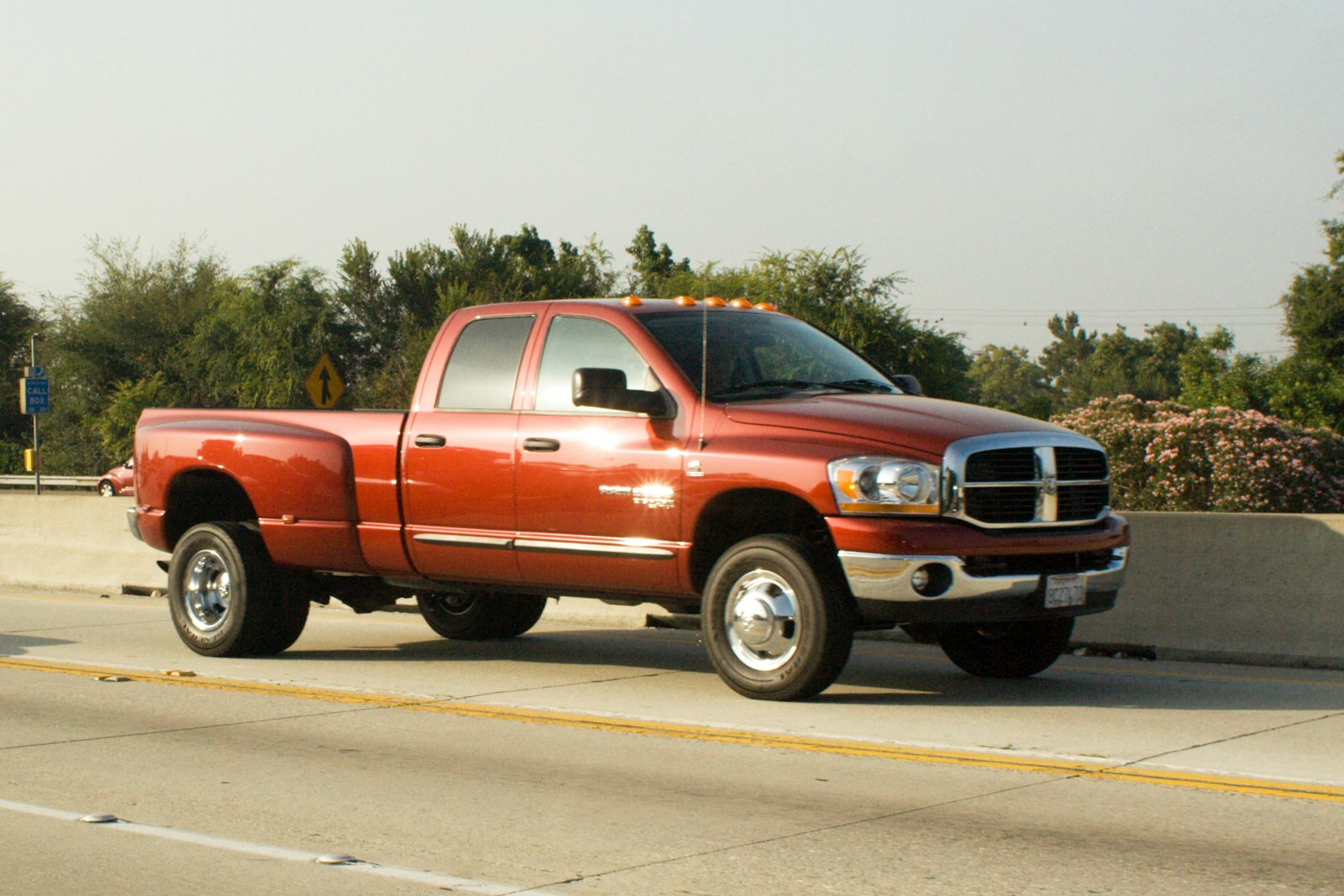 Orange dually heavy-duty pickup on highway